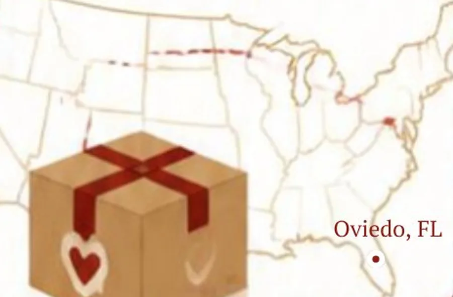 A parcel tied with red ribbon over a map of the United States.